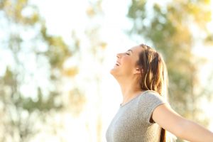 woman embracing happiness of self care